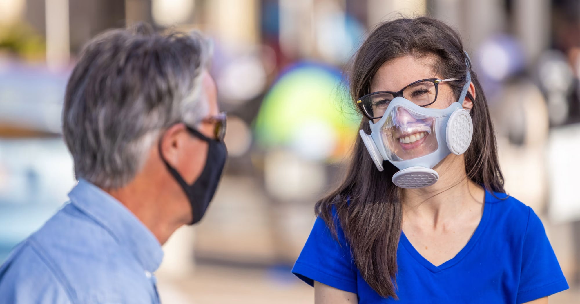 Woman wearing OmniMask talking with a friend